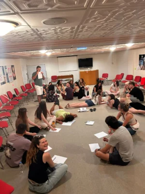 Youth participants engaging in a creative storytelling drawing activity during the Citizens of Tomorrow project