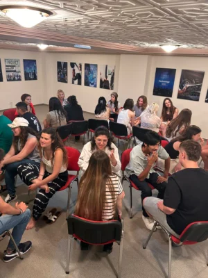 Young participants practising storytelling in paired discussions during the Citizens of Tomorrow youth exchange hosted by YETF in Paphos.