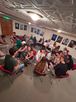 Participants practising fast-paced storytelling exchanges in small groups during the Citizens of Tomorrow youth exchange.