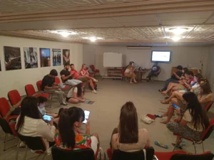 Youth workers exploring digital tools during an indoor workshop at the Into the Digital Erasmus+ training course.