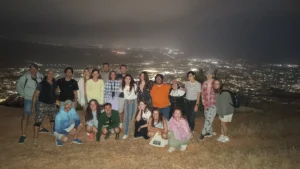 Night-time group photo of participants overlooking the city lights during the Into the Digital Erasmus+ Mobility in Paphos.