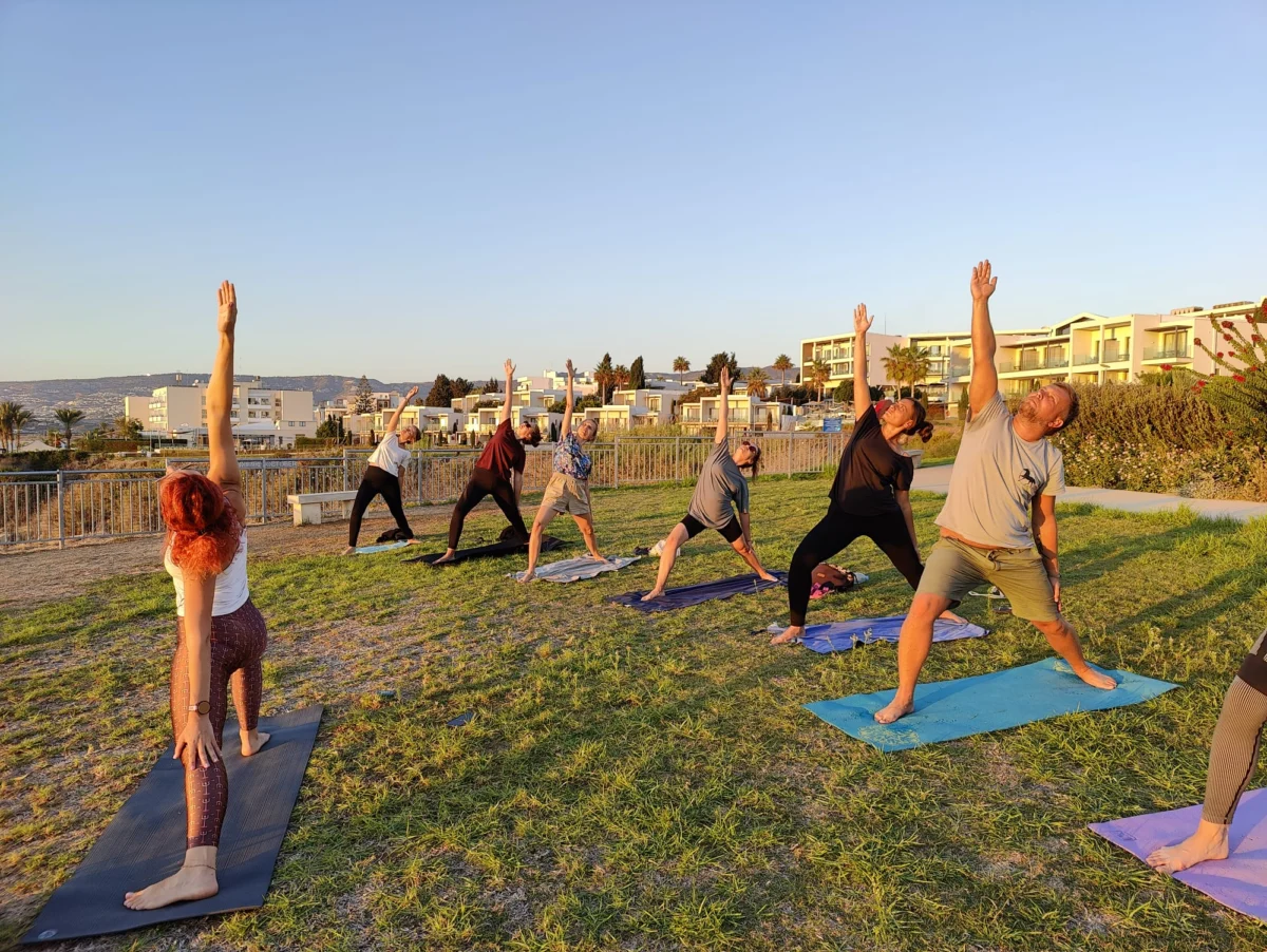 Youth workers practising outdoor yoga during the A Journey to Well-Being Erasmus+ training course in Paphos