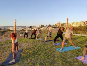 Youth workers practising outdoor yoga during the A Journey to Well-Being Erasmus+ training course in Paphos