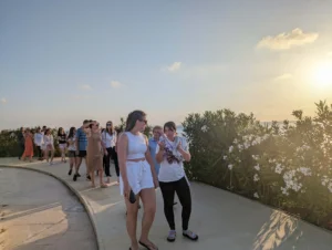 Participants walking and reflecting during an evening outdoor activity at the Level Up Your Leadership Skills training in Paphos.