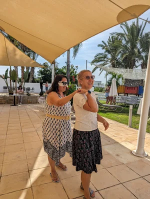 Two participants practising a trust-based leadership exercise outdoors during the Level Up Your Leadership Skills Erasmus+ training course hosted by YETF in Paphos.