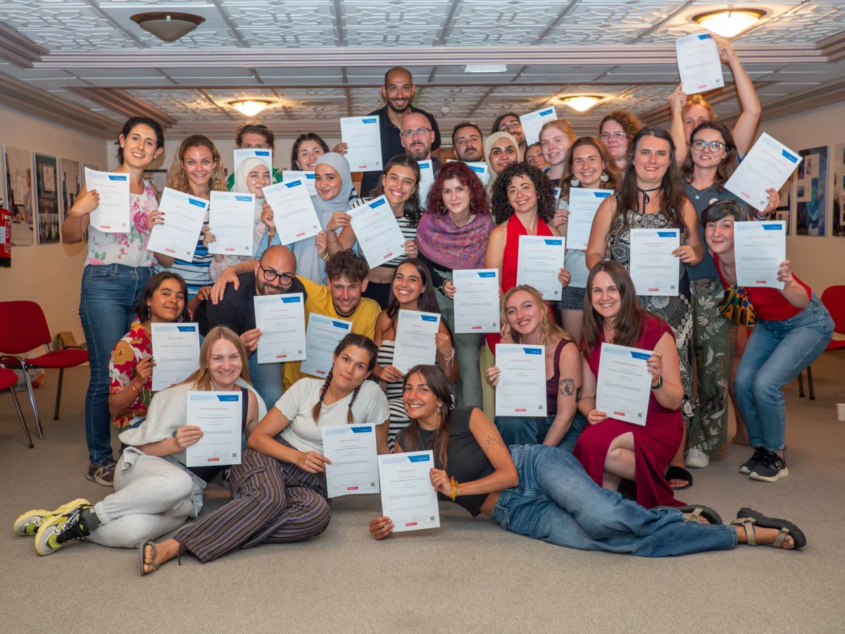 Large group of youth workers proudly holding their certificates at the end of the YETF ‘Power of Photography in Youth Work’ training course in Paphos.