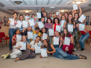 Large group of youth workers proudly holding their certificates at the end of the YETF ‘Power of Photography in Youth Work’ training course in Paphos.