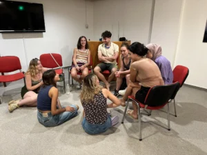 Youth workers collaborating in a small group during a creative photography workshop at the YETF training course.